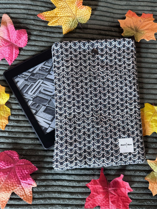 A kindle e-reader sleeve with a silver chainmail pattern for fantasy readers.