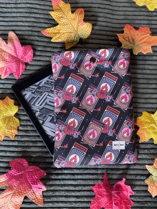 A handmade kindle e-reader sleeve featuring a repeating pattern of matchboxes for slow burn romance lovers.