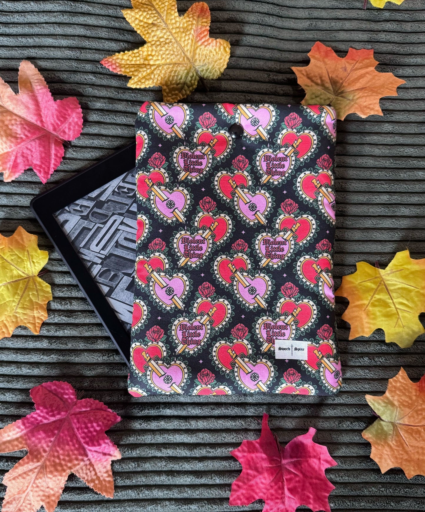 Featuring a Fourth Wing inspired patterned fabric handmade kindle sleeve.