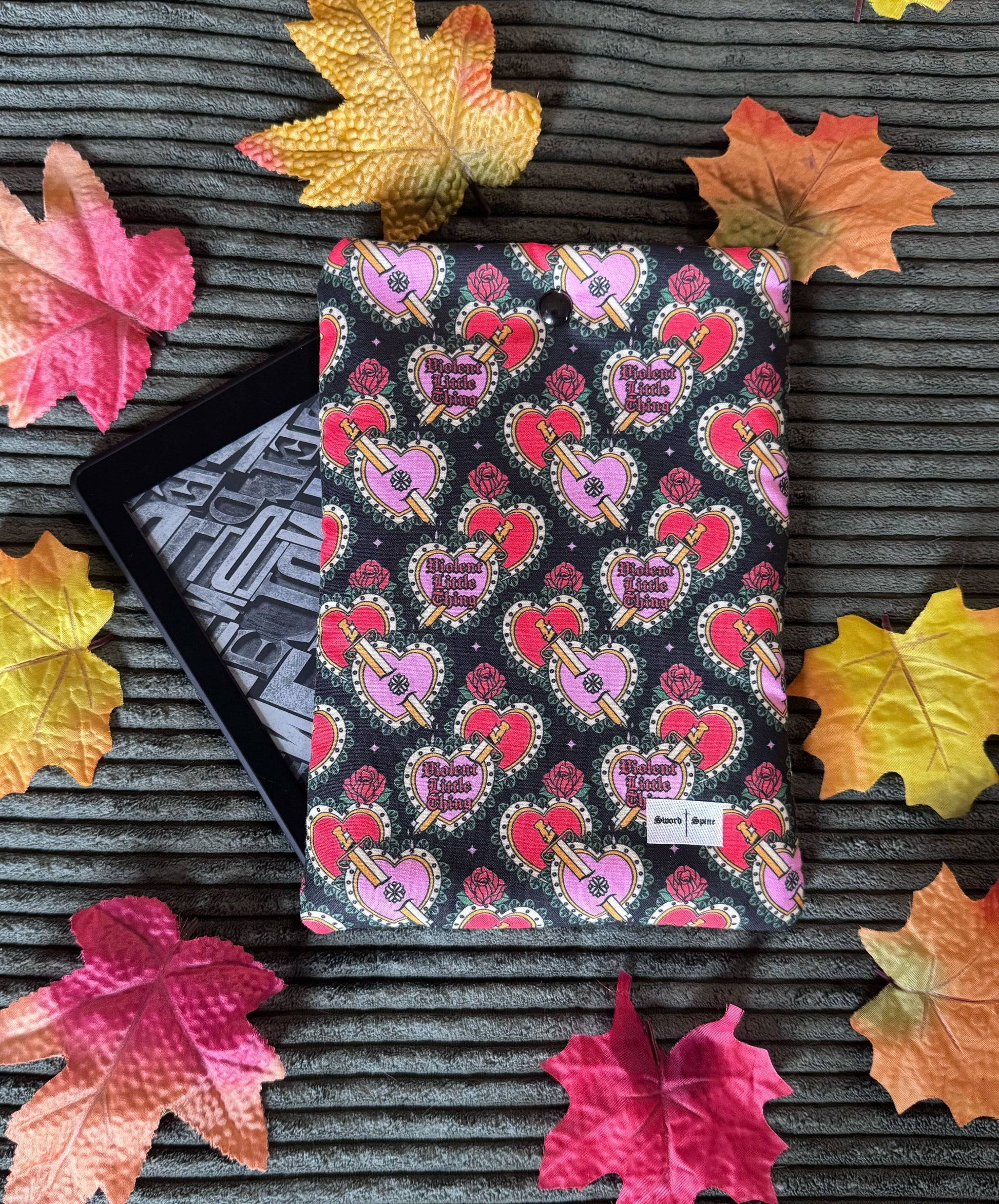 Featuring a Fourth Wing inspired patterned fabric handmade kindle sleeve.
