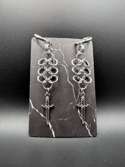 Click hoop earrings with silver chainmail and stainless steel daggers.