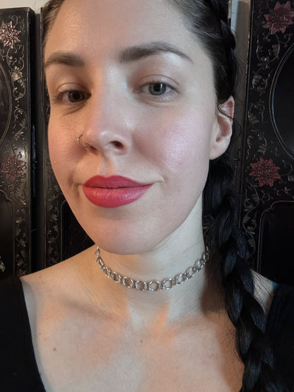 A woman wears a beautiful and delicate adjustable chainmail necklace.