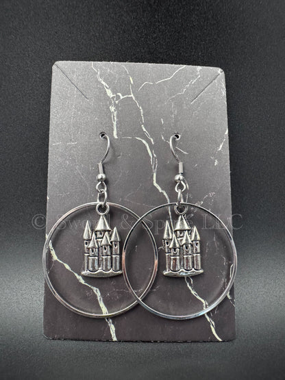 Dangled hoop earrings with an enchanted silver castle pendant in the middle.