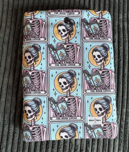 A padded e-reader sleeve with a pattern of tarot cards for book lovers.